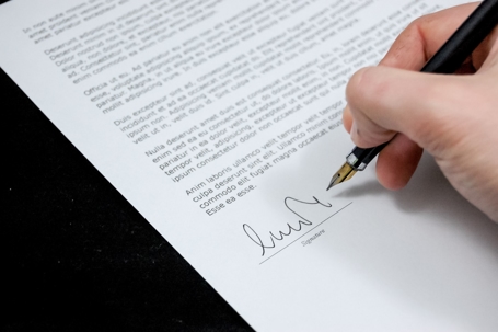 Person signing a contract